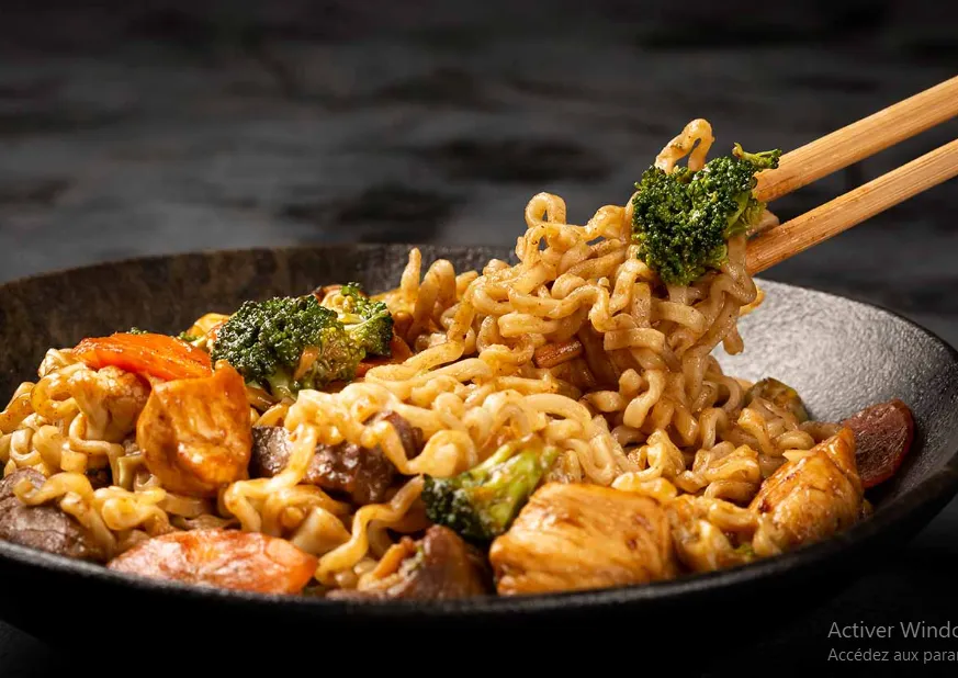 A vibrant bowl of Ngo Ngae Noodles, showcasing the rich blend of Thai flavors and ingredients
