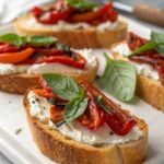 Crostini with goat cheese, roasted pepper & basil